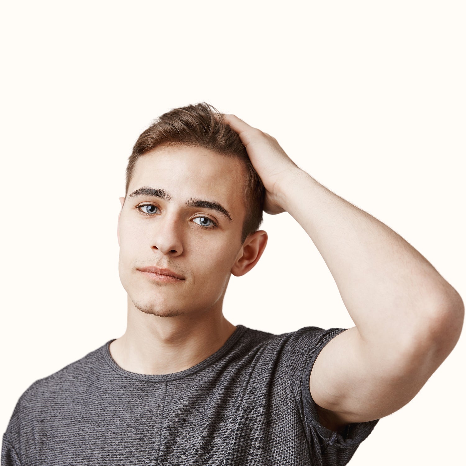 A young man showing the results using hair filling fibers to increase his hairline's density.